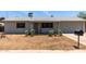 Charming single-story home with tidy landscaping, light gray paint, and an attached two-car garage at 18427 N 32Nd Ln, Phoenix, AZ 85053