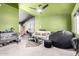 Eclectic living room featuring light walls, carpet flooring, and a modern ceiling fan at 18427 N 32Nd Ln, Phoenix, AZ 85053