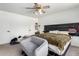 A comfortable main bedroom offers carpet floors and a seating area at 18427 N 32Nd Ln, Phoenix, AZ 85053
