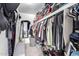The walk-in closet is fully organized with shelves and rods at 18427 N 32Nd Ln, Phoenix, AZ 85053