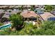 Aerial view of backyard with pool, patio, and lush landscaping at 30135 N 129Th Gln, Peoria, AZ 85383