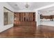 Open-concept dining area showcases a stunning custom built-in cabinet and hardwood floors at 30135 N 129Th Gln, Peoria, AZ 85383