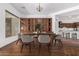 Elegant dining room features hardwood floors and a custom built-in cabinet with glass doors at 30135 N 129Th Gln, Peoria, AZ 85383