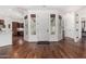 Bright entryway with hardwood floors and views to the kitchen, Gathering room and a large picture window at 30135 N 129Th Gln, Peoria, AZ 85383