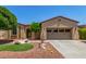 Charming single-story home featuring a well-manicured yard with desert landscaping and a spacious two-car garage at 30135 N 129Th Gln, Peoria, AZ 85383