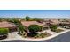 An exterior shot showing a well-maintained front yard in a desert landscape at 30135 N 129Th Gln, Peoria, AZ 85383