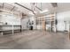 Spacious garage featuring ample shelving, epoxy floors, and organized storage solutions at 30135 N 129Th Gln, Peoria, AZ 85383
