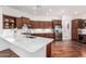 Modern kitchen with stainless steel appliances, spacious countertops, and ample cabinet space at 30135 N 129Th Gln, Peoria, AZ 85383