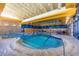 Indoor community pool with lap lanes and comfortable seating at 30135 N 129Th Gln, Peoria, AZ 85383