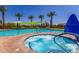 Resort-style pool area features a bubbling spa, lounge chairs and palm trees for the ultimate in outdoor relaxation at 30135 N 129Th Gln, Peoria, AZ 85383