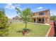 Expansive backyard featuring lush lawn and tasteful landscaping, providing an outdoor retreat at 30375 W Verde Ln, Buckeye, AZ 85396