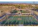 Aerial view of the basketball courts with desert landscaping and mountain views at 30375 W Verde Ln, Buckeye, AZ 85396