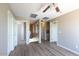 Hallway with wood flooring, providing an airy feel and connection to other rooms at 30375 W Verde Ln, Buckeye, AZ 85396