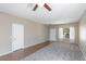 Inviting living area featuring a mix of carpet and tile flooring and abundant natural light at 30375 W Verde Ln, Buckeye, AZ 85396