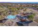 Aerial view of the community playground with splash pad, play structures, seating, and desert landscaping at 30375 W Verde Ln, Buckeye, AZ 85396