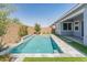 Landscaped backyard featuring a swimming pool and privacy fence with new landscaping at 3260 W Caleb Rd, Phoenix, AZ 85083