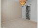 Bedroom features stylish walls, light fixture and a laundry room behind a sliding door at 3260 W Caleb Rd, Phoenix, AZ 85083
