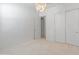 Bedroom featuring plush carpet and sliding door closet with stylish lighting fixture at 3260 W Caleb Rd, Phoenix, AZ 85083