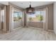 Dining room with decorative light fixture and natural light from backyard view at 3260 W Caleb Rd, Phoenix, AZ 85083