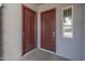 Close-up of two doors inside the entry of a home with a small window on the right at 3260 W Caleb Rd, Phoenix, AZ 85083