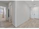 Neutral hallway with tile floors, white walls, recessed lighting, and doors leading to other rooms at 3260 W Caleb Rd, Phoenix, AZ 85083