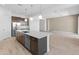 Modern kitchen featuring stainless steel appliances, a large island, and stylish pendant lighting at 3260 W Caleb Rd, Phoenix, AZ 85083