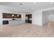 Spacious kitchen with a large island, stainless appliances, and modern pendant lighting at 3260 W Caleb Rd, Phoenix, AZ 85083