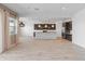 Bright, open kitchen with tile floors, sleek countertops, and stainless steel appliances at 3260 W Caleb Rd, Phoenix, AZ 85083