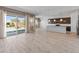 Open concept living area with tile floors, sliding glass doors to the pool, and gourmet kitchen at 3260 W Caleb Rd, Phoenix, AZ 85083