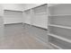 Spacious walk-in closet featuring built in shelving and hanging racks at 3260 W Caleb Rd, Phoenix, AZ 85083