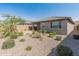 A desert landscaped backyard with gravel and various plants at 3264 W Caleb Rd, Phoenix, AZ 85083