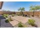 Charming backyard with stone ground cover, pavers, desert plants and a block wall at 3264 W Caleb Rd, Phoenix, AZ 85083