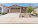 Charming single-story home featuring a desert landscape, a two-car garage, and a welcoming beige facade at 3264 W Caleb Rd, Phoenix, AZ 85083