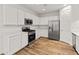 Well-lit kitchen showcasing white cabinets and stainless steel appliances at 3264 W Caleb Rd, Phoenix, AZ 85083