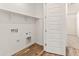 Laundry room with wood look floors, utility sink hook ups, and shelf at 3264 W Caleb Rd, Phoenix, AZ 85083