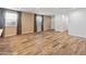 Living space featuring hardwood floors, two large windows and modern lighting at 3264 W Caleb Rd, Phoenix, AZ 85083