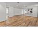 Expansive living area featuring beautiful wood-look floors and an open floor plan at 3264 W Caleb Rd, Phoenix, AZ 85083