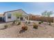 Backyard featuring low maintenance desert landscaping, brick wall and gravel at 3268 W Caleb Rd, Phoenix, AZ 85083