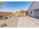 Backyard featuring rock landscaping and a brick privacy fence at 3268 W Caleb Rd, Phoenix, AZ 85083