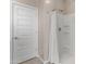 Bathroom features a shower with white shower curtain at 3268 W Caleb Rd, Phoenix, AZ 85083