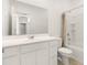 Bright bathroom features a wide mirror, white vanity, and shower-tub combo at 3268 W Caleb Rd, Phoenix, AZ 85083