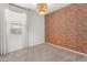 Bedroom with carpeted floors and an accent wall at 3268 W Caleb Rd, Phoenix, AZ 85083
