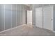 Bedroom with light gray walls, white painted stripes, and sliding closet doors at 3268 W Caleb Rd, Phoenix, AZ 85083