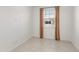 Neutral bedroom with tiled floor, window, and tan colored curtains at 3268 W Caleb Rd, Phoenix, AZ 85083