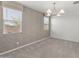 Dining room with large windows and modern chandelier at 3268 W Caleb Rd, Phoenix, AZ 85083