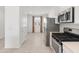 Bright kitchen featuring stainless steel appliances, a gas range, and an adjacent dining area at 3268 W Caleb Rd, Phoenix, AZ 85083