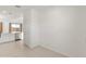 Spacious living room with tiled floors leading into the kitchen with stainless steel appliances at 3268 W Caleb Rd, Phoenix, AZ 85083