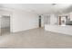 Bright, airy living room with open floor plan; kitchen view at 3268 W Caleb Rd, Phoenix, AZ 85083