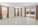 Bright living room with large windows and sliding glass doors to the backyard at 3268 W Caleb Rd, Phoenix, AZ 85083