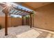 Back patio featuring pavers and a wooden pergola for shade and style at 3443 E Jasper Dr, Gilbert, AZ 85296